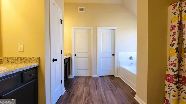 a white toilet sitting next to a small bathroom