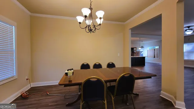 a view of kitchen with sink and fireplace
