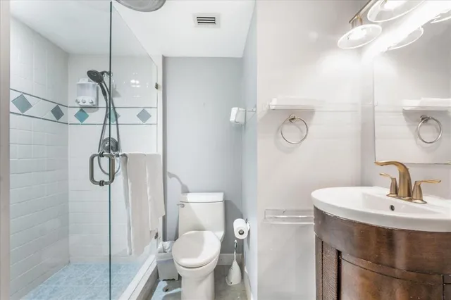 a view of a patio with table and chairs and potted plants