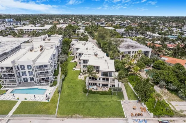 an aerial view of a multi story parking building