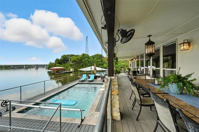 a view of balcony with chairs and wooden floor
