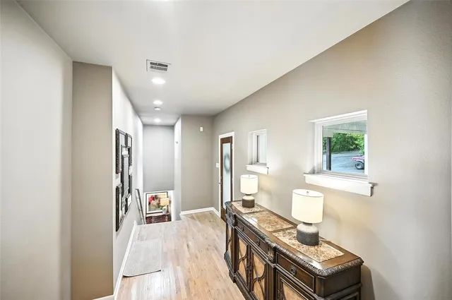 a living room with a bed furniture and a window
