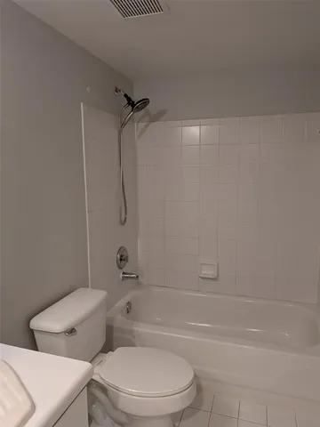 a front view of a house with a yard garage and outdoor seating