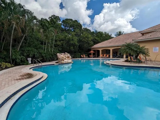 a view of a house with a yard porch and sitting area
