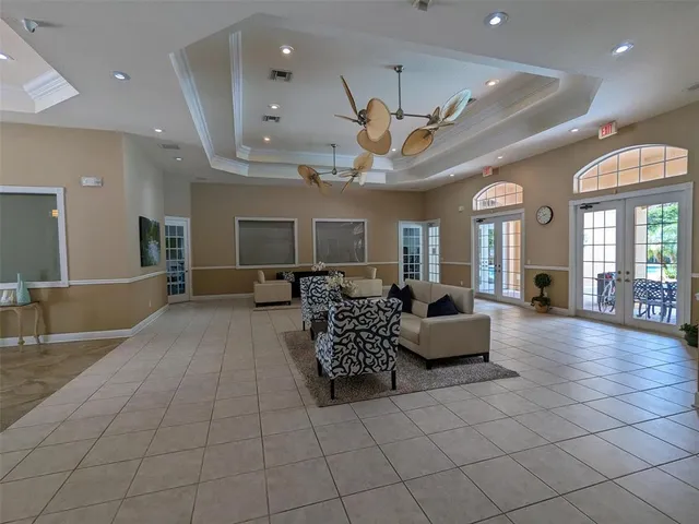 a living room with furniture and windows