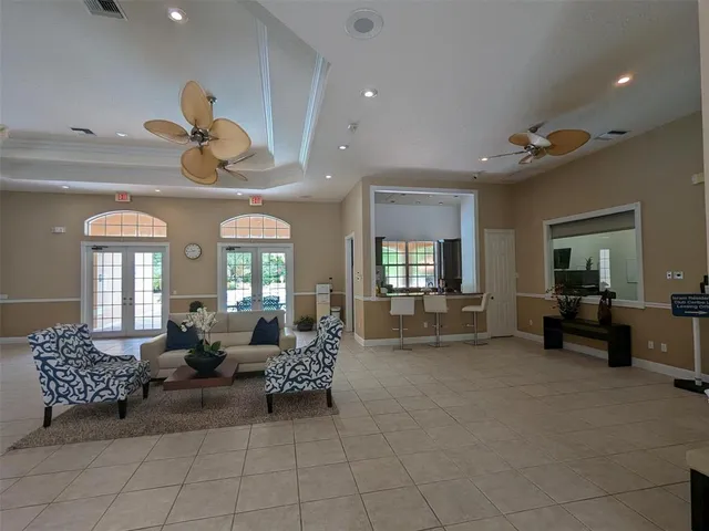 a view of a house with a yard and potted plants