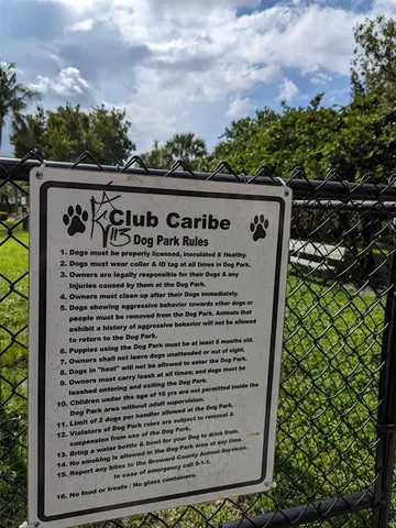 a view of a park with large trees