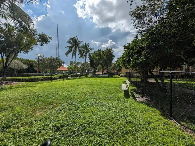 a view of outdoor space with deck and yard