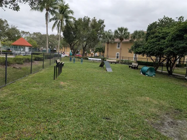 a view of a house with a backyard porch and sitting area