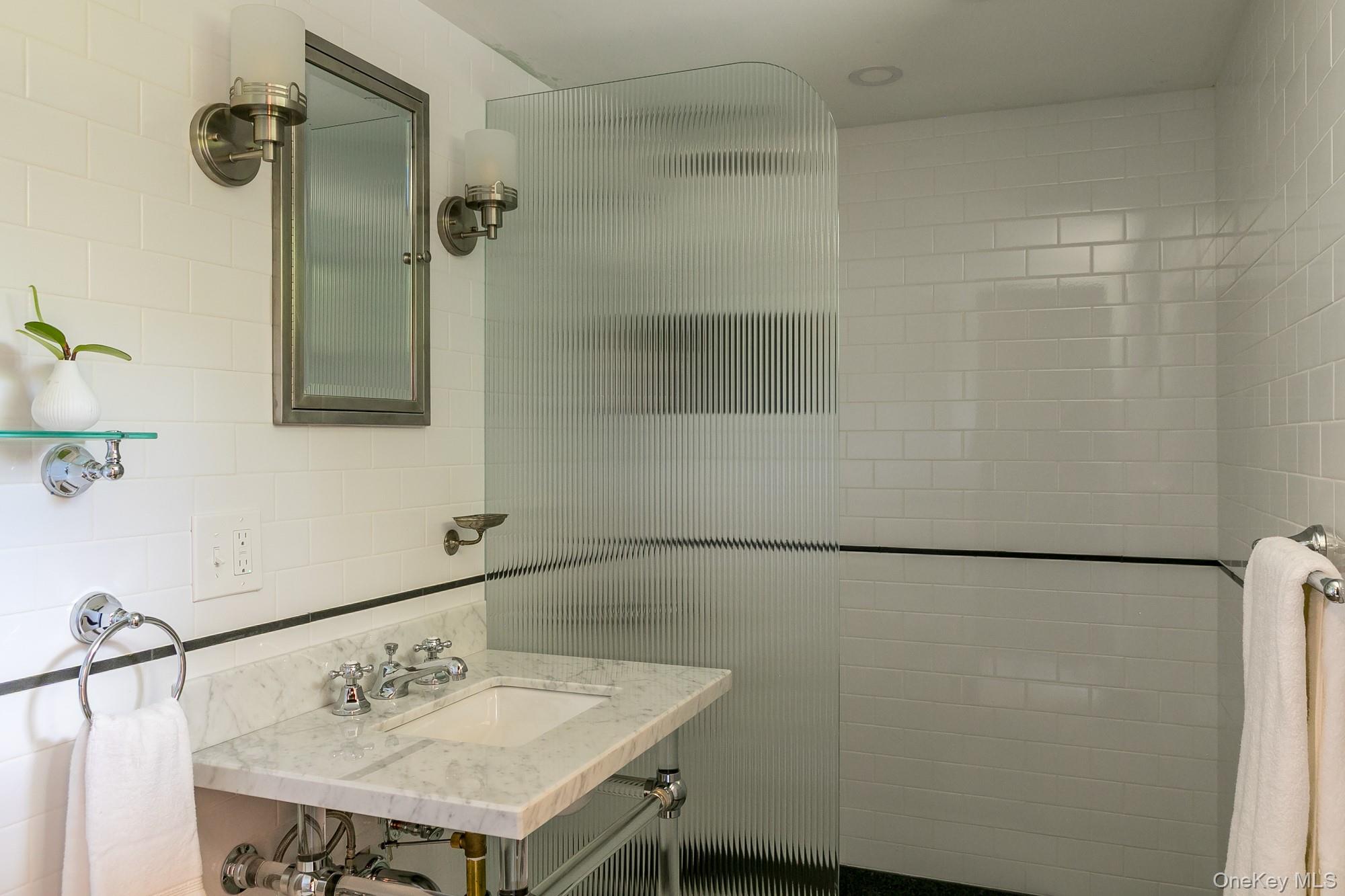 35 Fern Hollow Road Stone Ridge, NY 12484 - Photo 16 of 40 a bathroom with a sink and a mirror