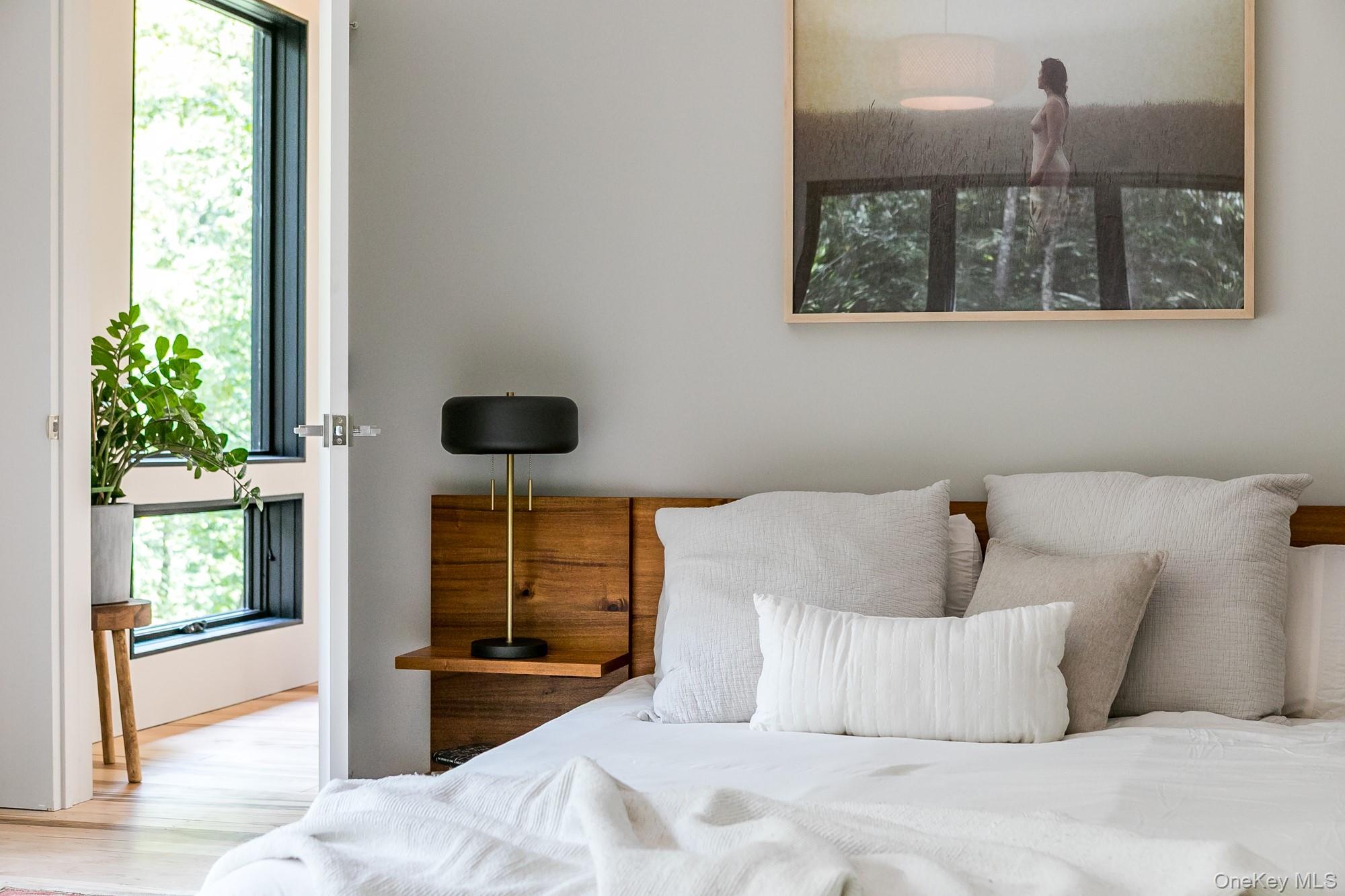 35 Fern Hollow Road Stone Ridge, NY 12484 - Photo 22 of 40 a bedroom with a bed and a window