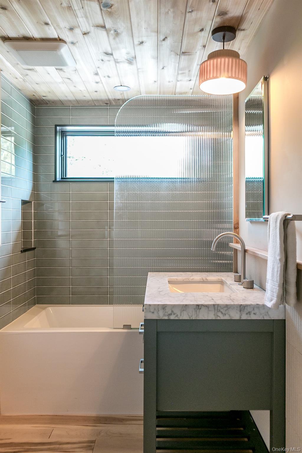 35 Fern Hollow Road Stone Ridge, NY 12484 - Photo 37 of 40 a bathroom with a granite countertop sink a bathtub and a window