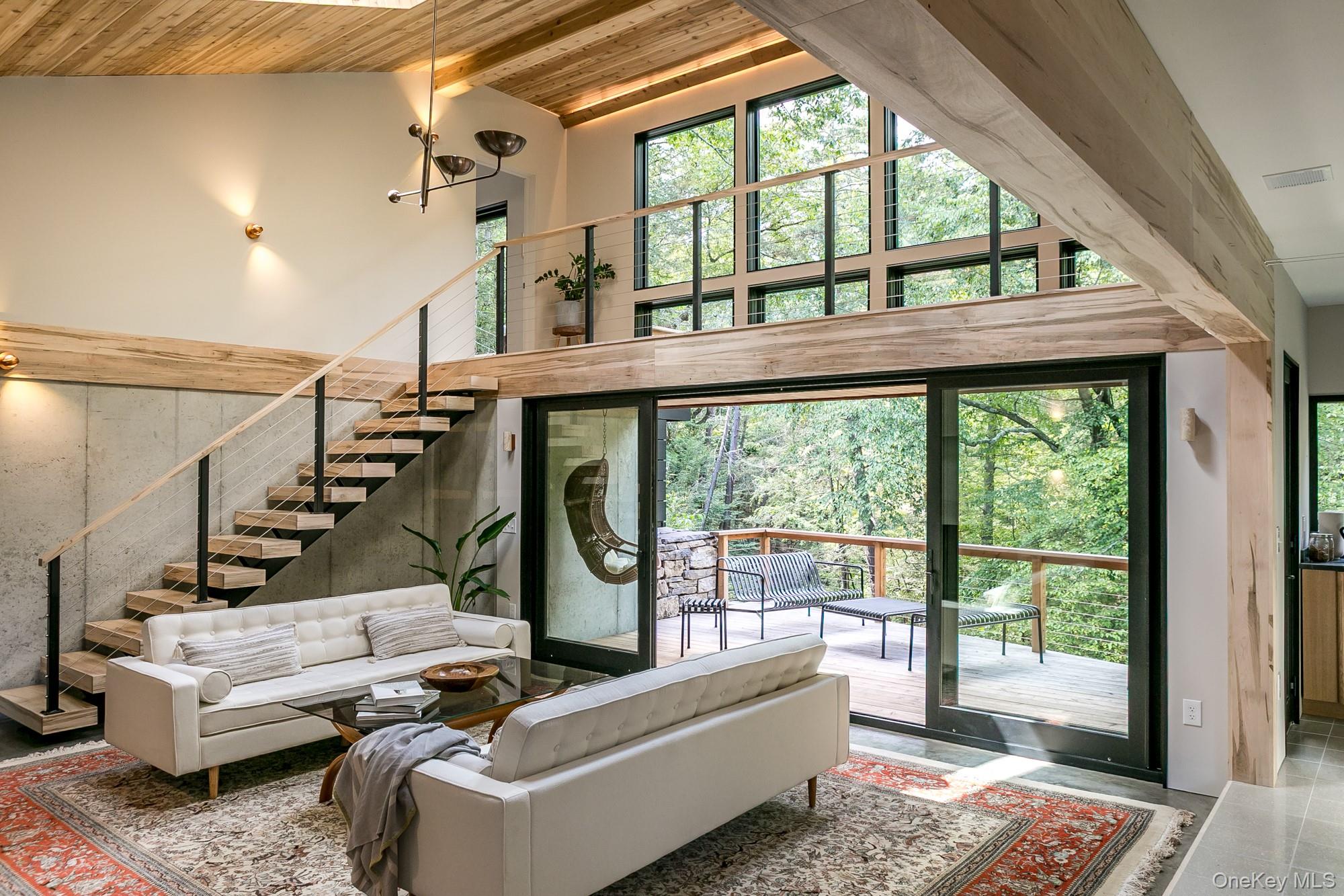 35 Fern Hollow Road Stone Ridge, NY 12484 - Photo 9 of 40 a living room with furniture and a floor to ceiling window