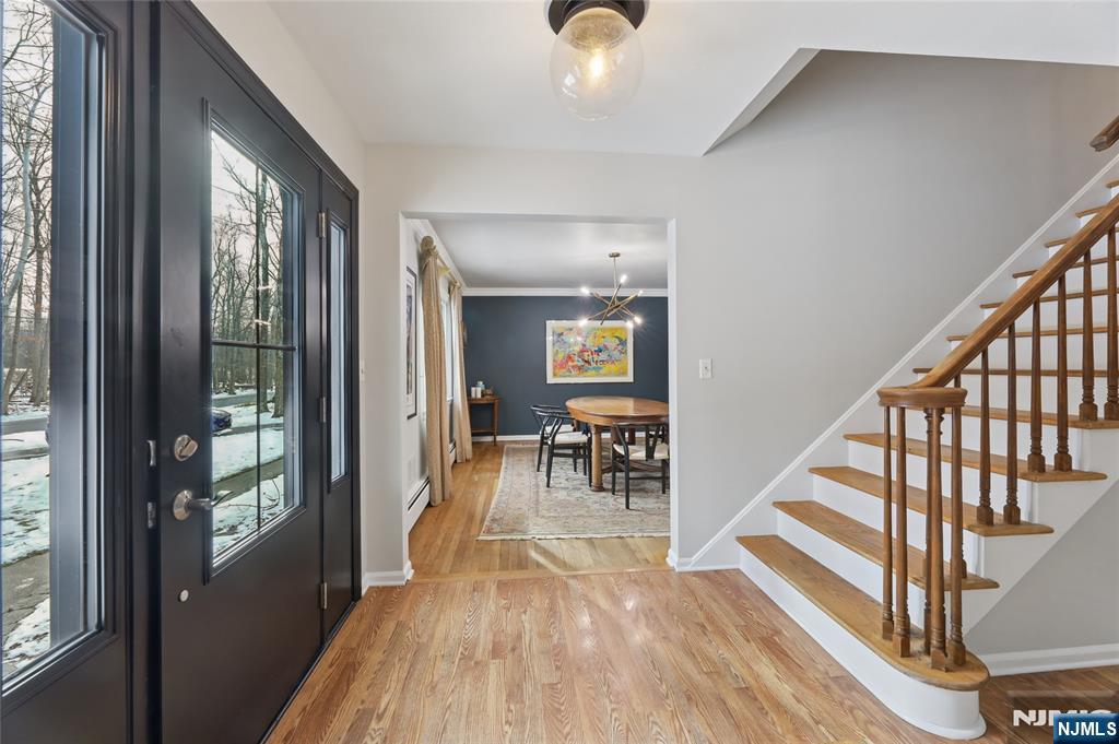 320 Park Street Haworth, NJ 07641 - Photo 14 of 48 a view of dining room with furniture floor to ceiling windows and wooden floor