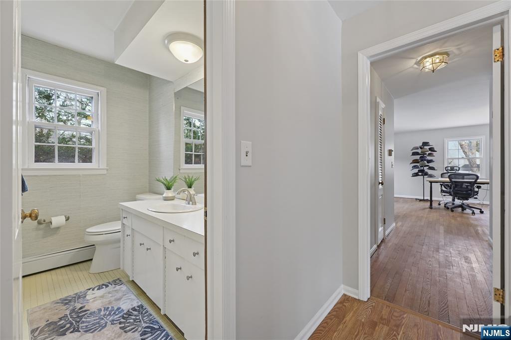 320 Park Street Haworth, NJ 07641 - Photo 24 of 48 a bathroom with a sink and mirror
