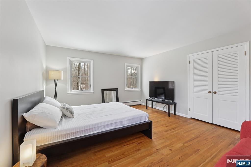 320 Park Street Haworth, NJ 07641 - Photo 36 of 48 a bedroom with a bed and a flat screen tv