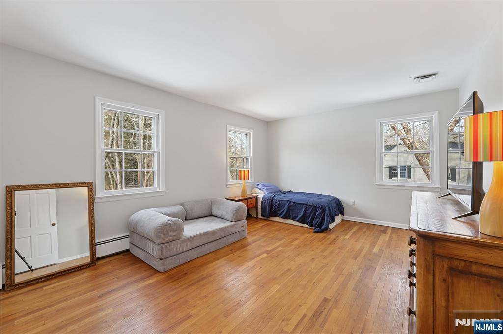 320 Park Street Haworth, NJ 07641 - Photo 37 of 48 a bedroom with furniture and a flat screen tv
