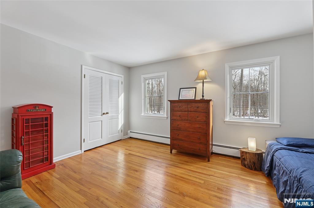 320 Park Street Haworth, NJ 07641 - Photo 42 of 48 a view of a bedroom with furniture and wooden floor