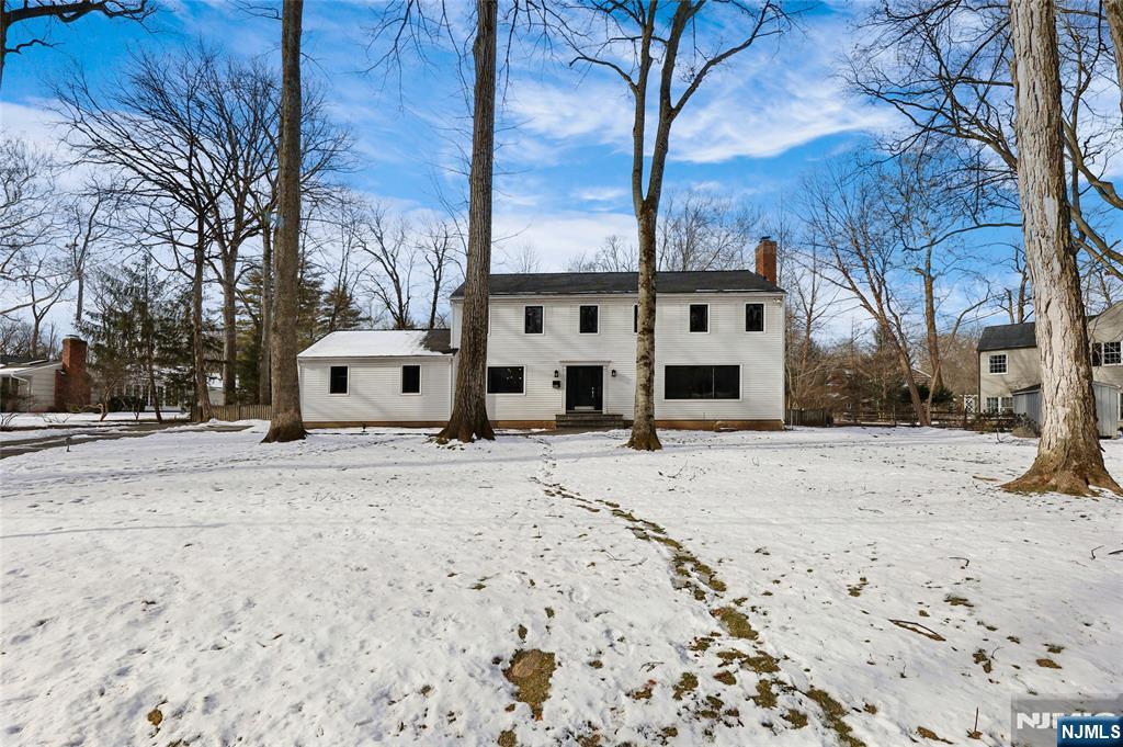 320 Park Street Haworth, NJ 07641 - Photo 7 of 48 a front view of a house with a yard covered in snow