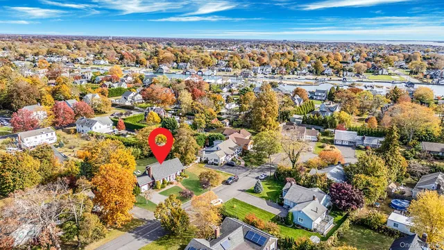 an aerial view of a house with a yard and garden