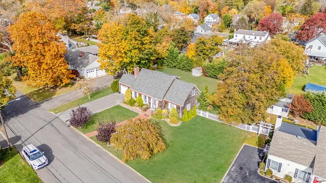 a kitchen with a refrigerator and white cabinets