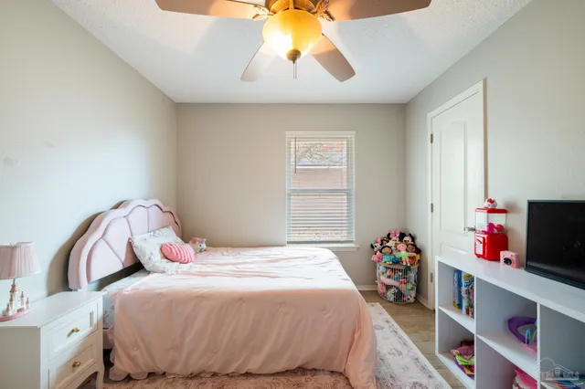 a view of a room with toys and wooden floor
