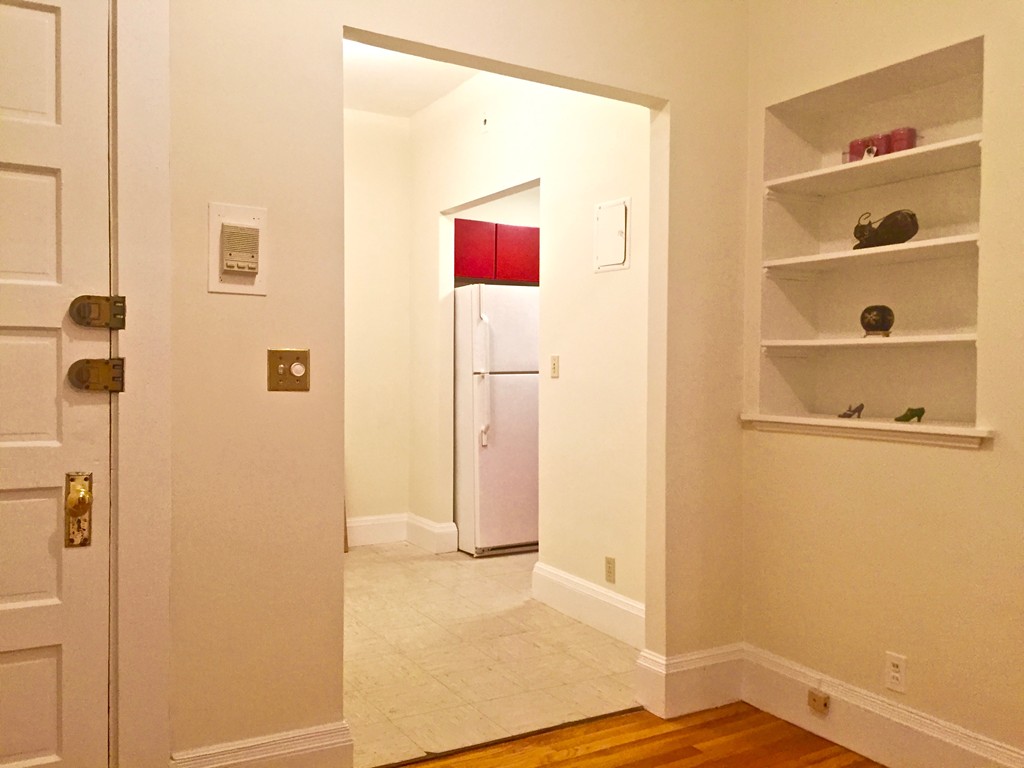 1056 Beacon Street, Unit 15 Brookline, MA 02446 - Photo 5 of 9 a view of a hallway with closet