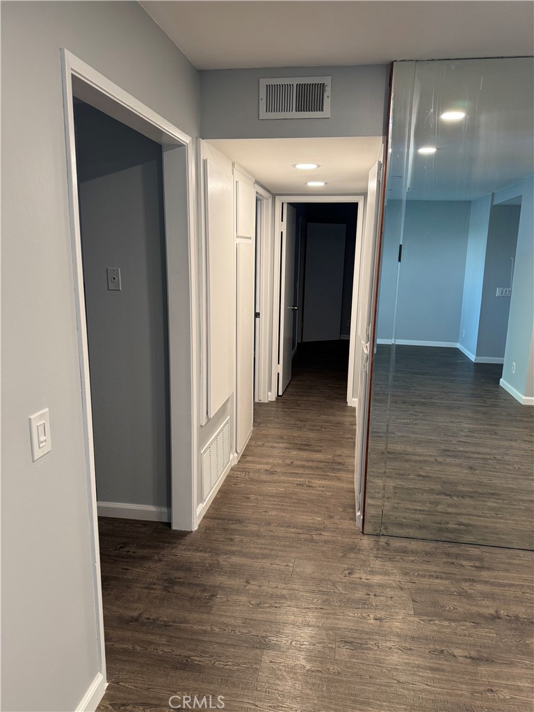 13602 La Jolla Circle, Unit B La Mirada, CA 90638 - Photo 11 of 27 a view of a hallway with wooden floor