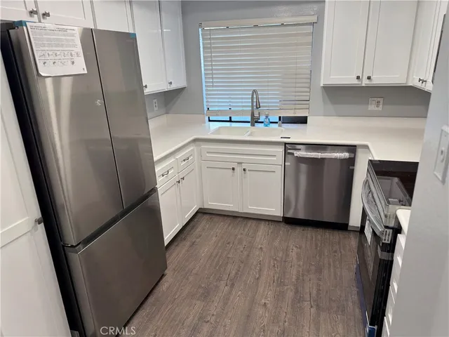 a kitchen with microwave and cabinets
