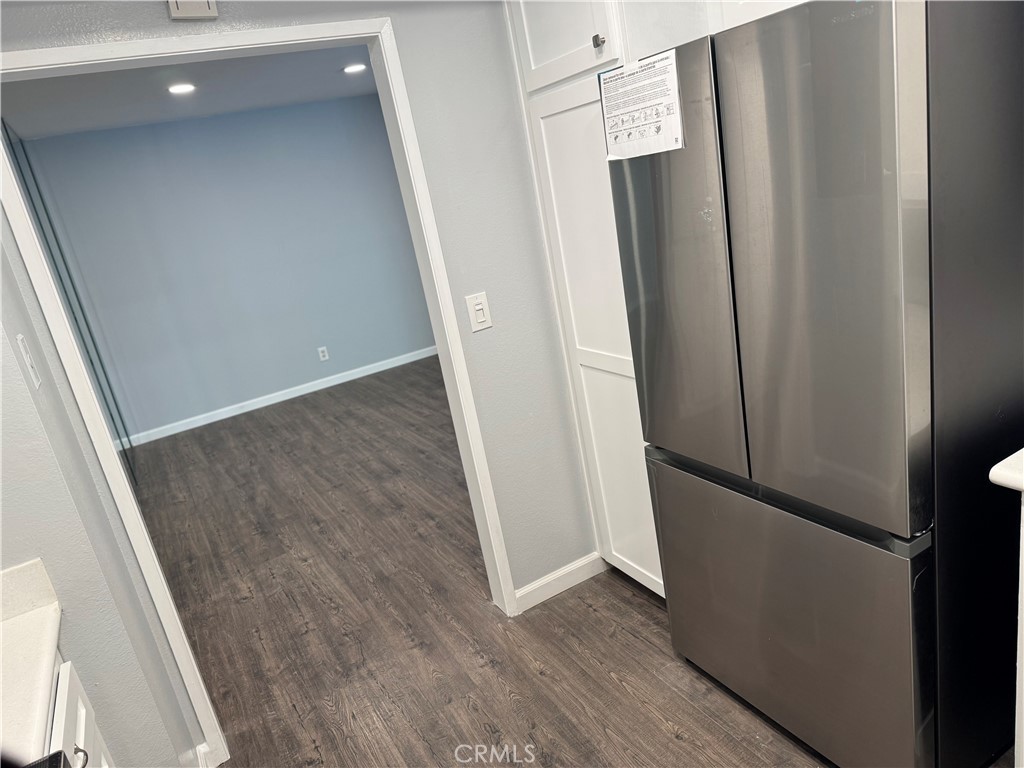 13602 La Jolla Circle, Unit B La Mirada, CA 90638 - Photo 14 of 27 a view of a hallway with wooden floor