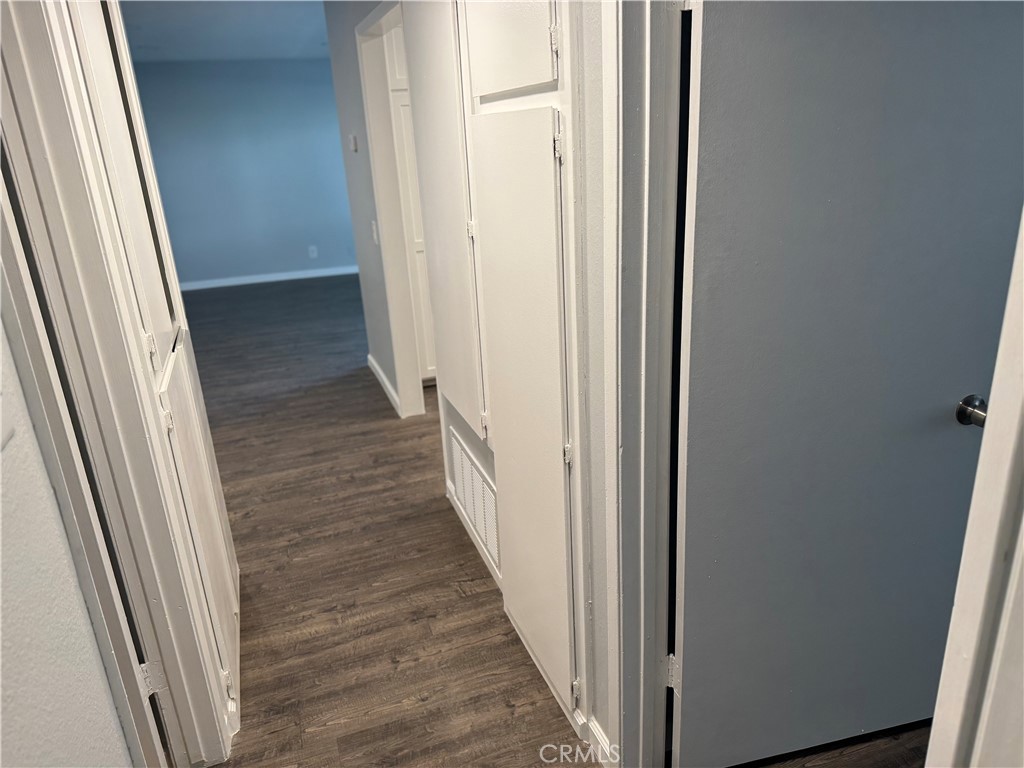 13602 La Jolla Circle, Unit B La Mirada, CA 90638 - Photo 15 of 27 a view of a hallway with wooden floor