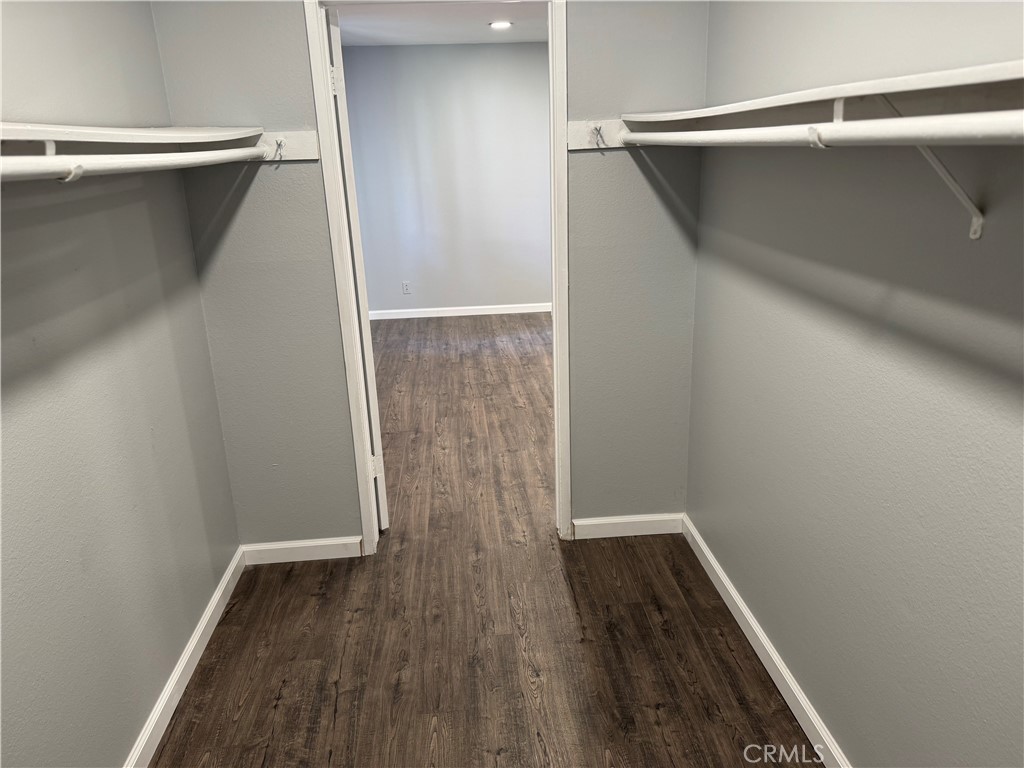 13602 La Jolla Circle, Unit B La Mirada, CA 90638 - Photo 20 of 27 a view of walk in closet with wooden floor