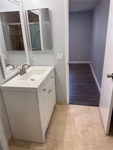 a white toilet sitting next to a bathroom sink