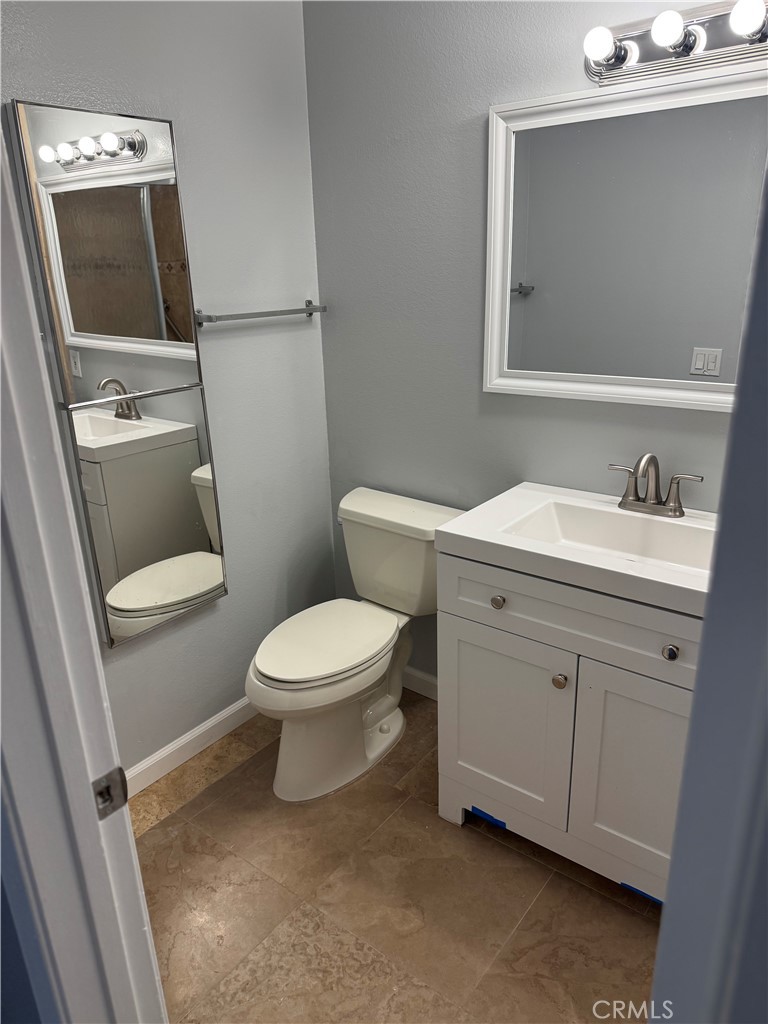 13602 La Jolla Circle, Unit B La Mirada, CA 90638 - Photo 25 of 27 a white toilet sitting next to a bathroom sink