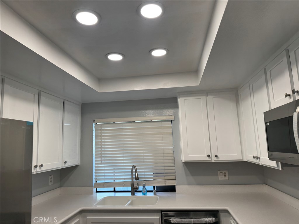 13602 La Jolla Circle, Unit B La Mirada, CA 90638 - Photo 27 of 27 a kitchen with a sink and cabinets