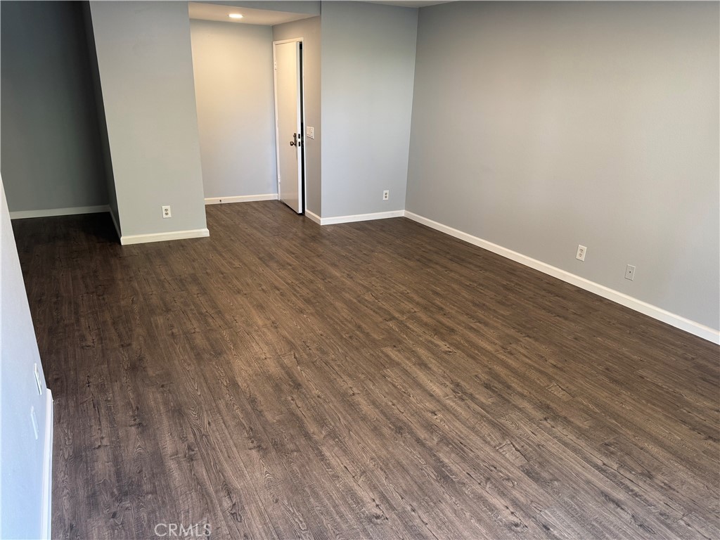 13602 La Jolla Circle, Unit B La Mirada, CA 90638 - Photo 9 of 27 an empty room with wooden floor and entrance