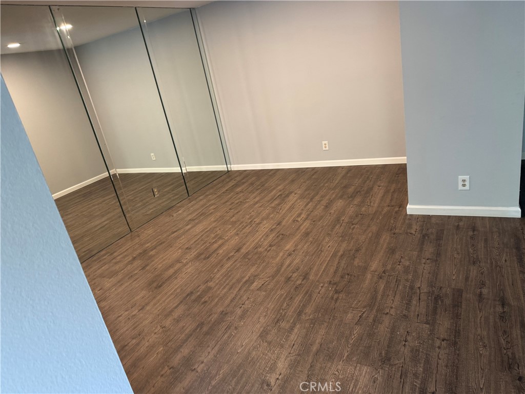 13602 La Jolla Circle, Unit B La Mirada, CA 90638 - Photo 10 of 27 a view of an empty room with wooden floor