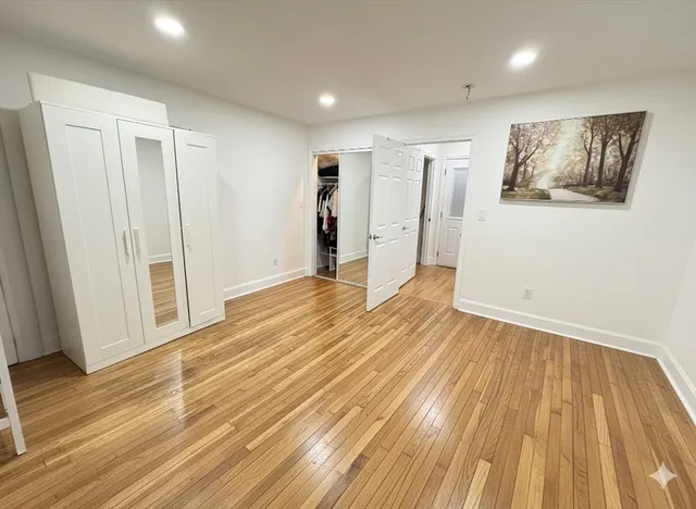 a view of a room with wooden floor and stairs