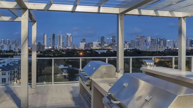 a view of a balcony with wooden floor and outdoor seating