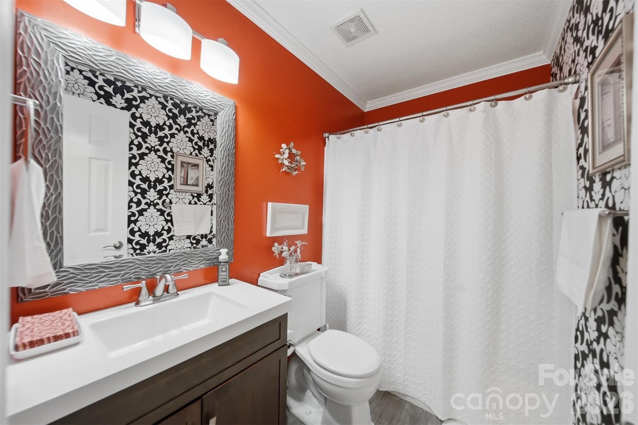 2104 Sheffield Court Northwest Conover, NC 28613 - Photo 18 of 25 a bathroom with a sink and a toilet