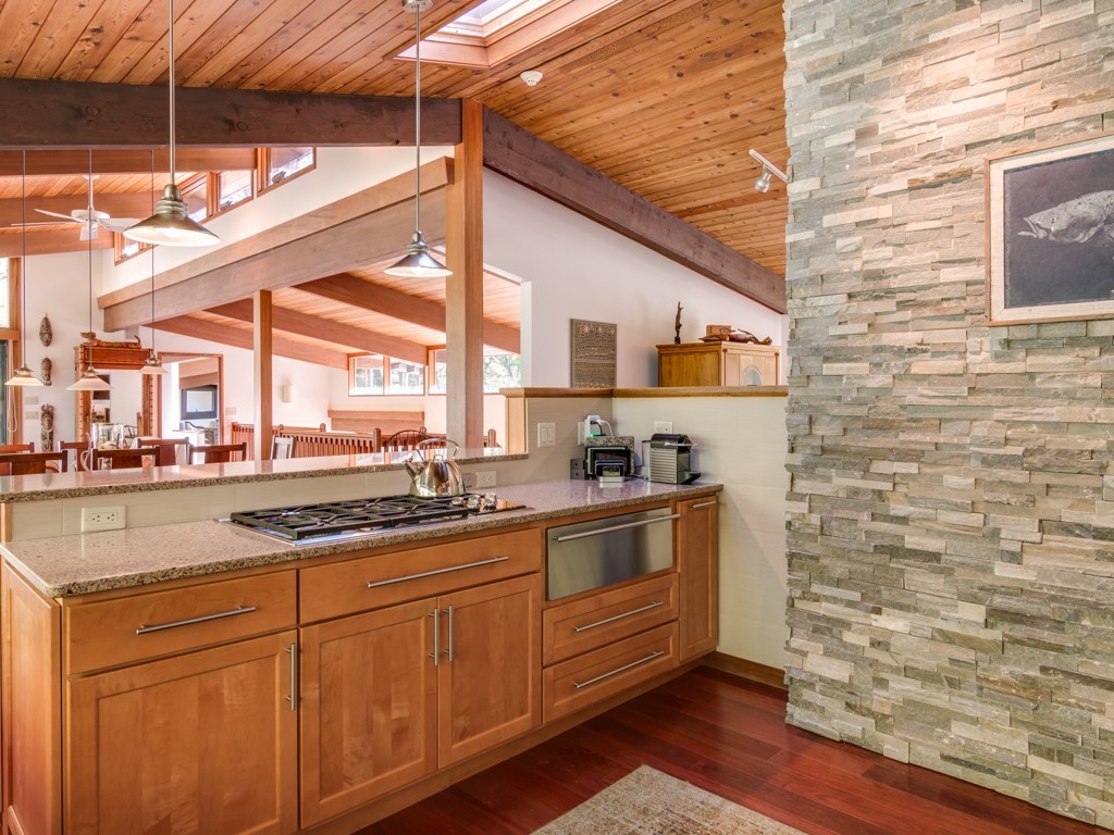 22 Bray Street Gloucester, MA 01930 - Photo 11 of 37 a kitchen with stainless steel appliances granite countertop a sink a stove and cabinets