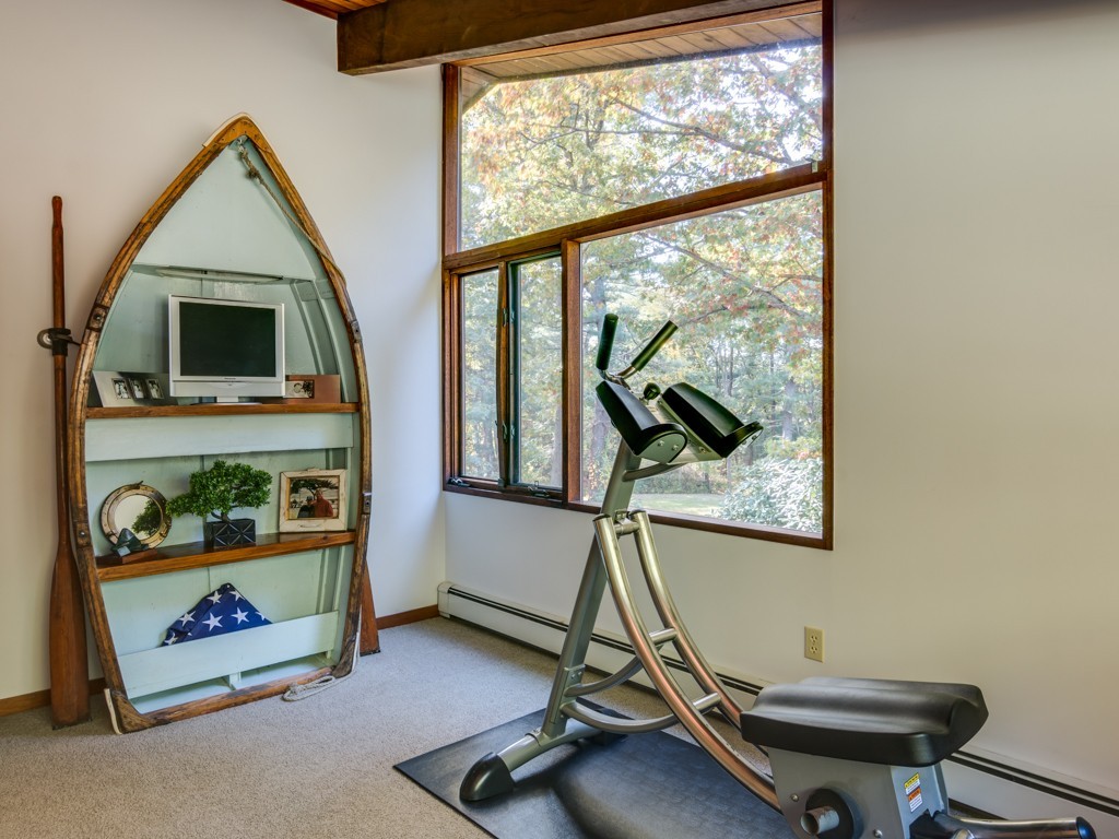 22 Bray Street Gloucester, MA 01930 - Photo 15 of 37 a room with gym equipment and a large window