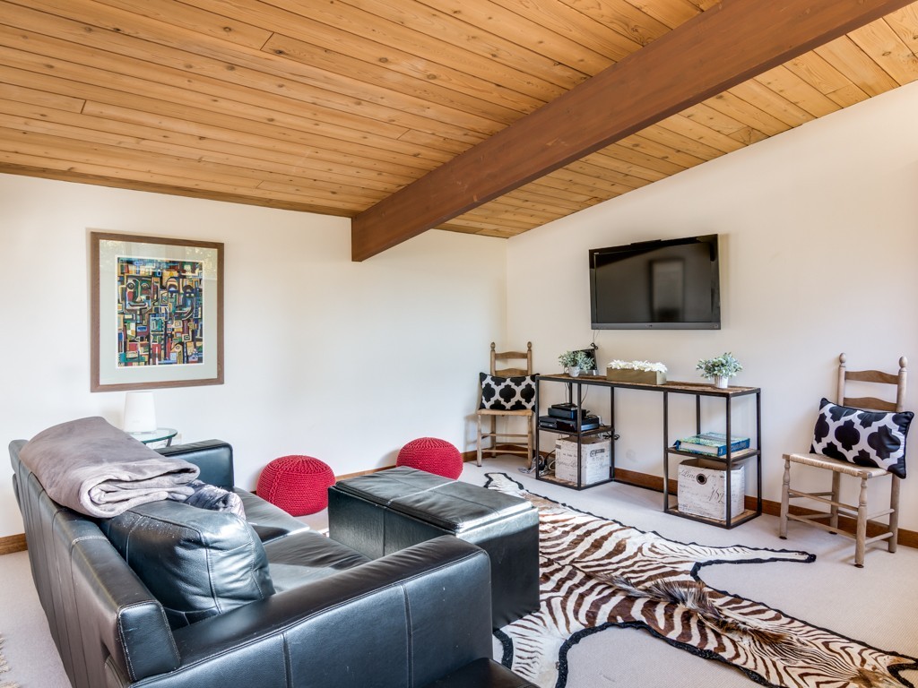 22 Bray Street Gloucester, MA 01930 - Photo 18 of 37 a living room with furniture and a flat screen tv