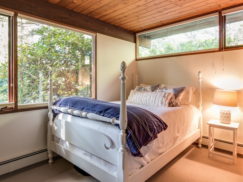 22 Bray Street Gloucester, MA 01930 - Photo 21 of 37 a bed sitting in a bedroom next to a window