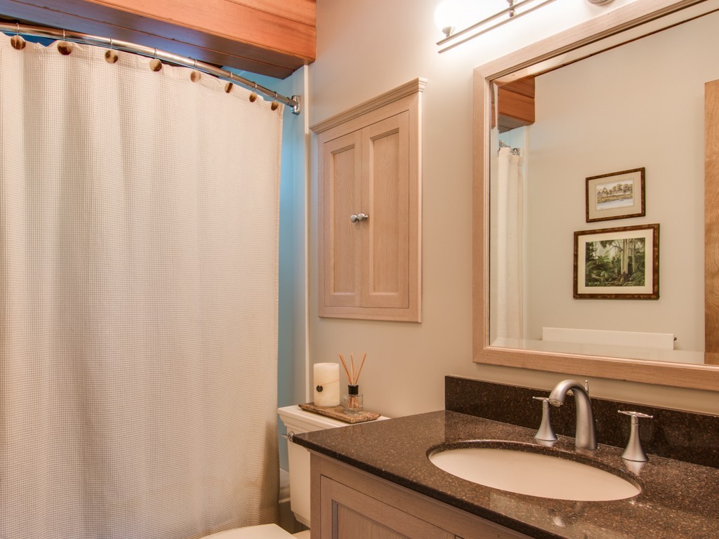 22 Bray Street Gloucester, MA 01930 - Photo 23 of 37 a bathroom with a granite countertop sink and a mirror