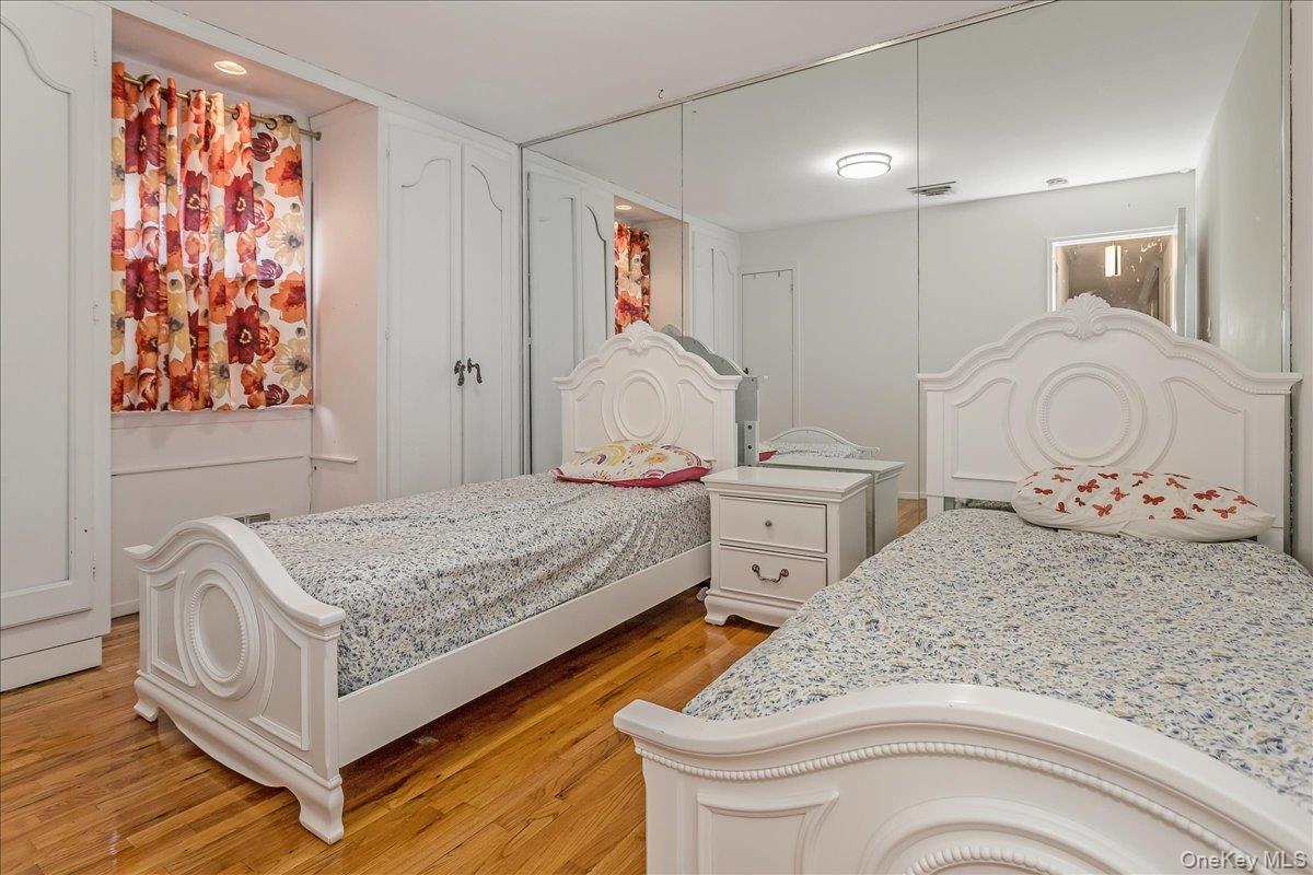 93 Searingtown Road Albertson, NY 11507 - Photo 11 of 24 Bedroom featuring light wood-type flooring