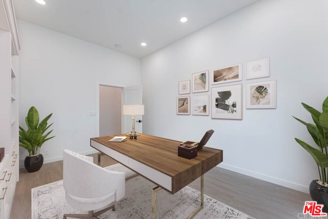 1177 Aztec Topanga, CA 90290 - Photo 17 of 43 a living room with furniture a potted plant and a flat screen tv