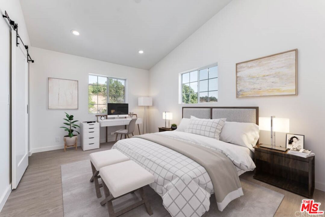 1177 Aztec Topanga, CA 90290 - Photo 30 of 43 a bedroom with a bed and furniture