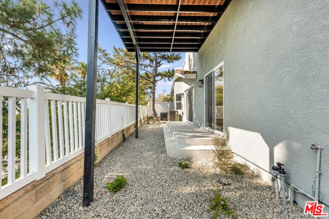 1177 Aztec Topanga, CA 90290 - Photo 32 of 43 a porch with table and chairs