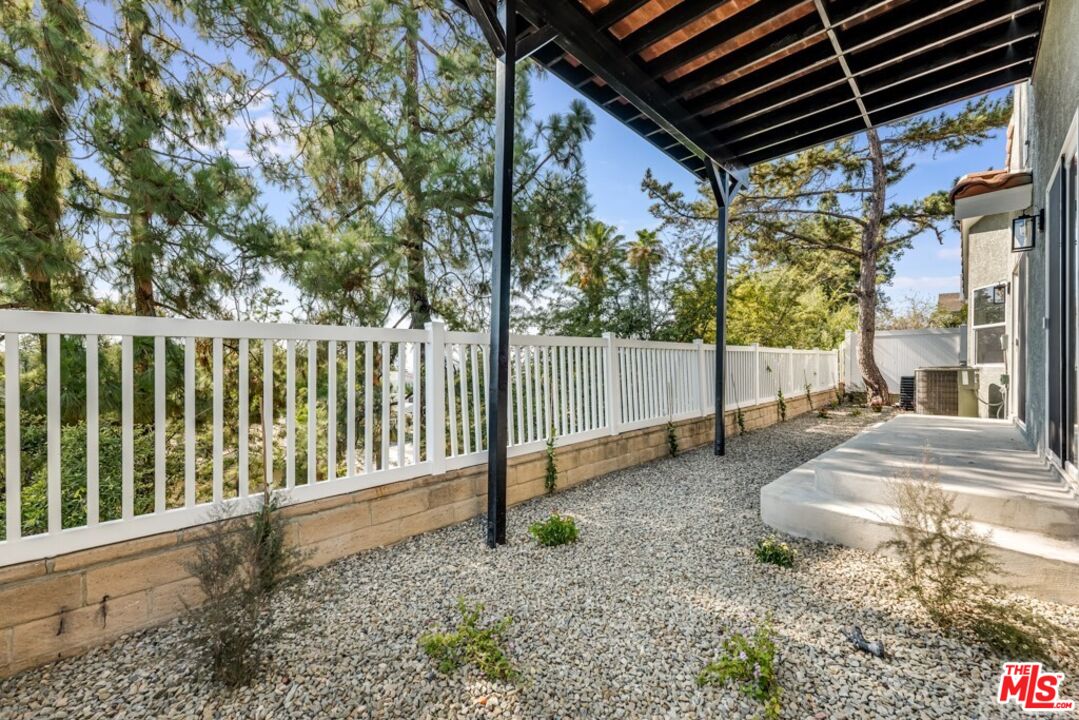 1177 Aztec Topanga, CA 90290 - Photo 33 of 43 a backyard of a house with plants and outdoor seating